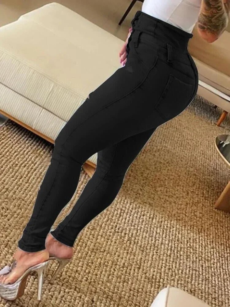 High-waist black skinny jeans with back pockets and curve-accentuating fit