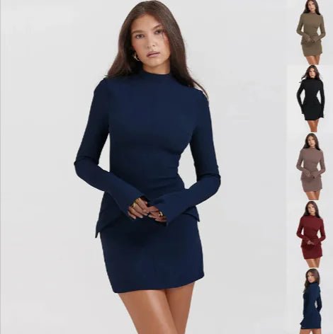 Woman wearing a navy blue slimline midi dress with long sleeves and a high neckline.