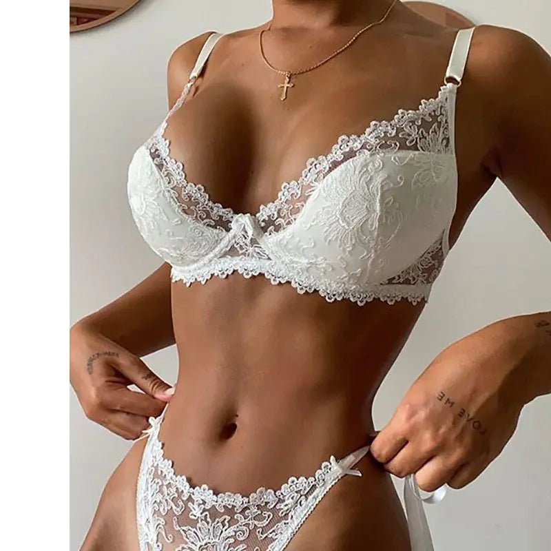 Delicate white lace sleepwear set with a floral pattern and adjustable straps