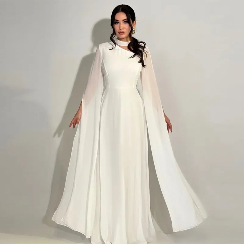 Elegant white long-sleeve chiffon dress for women with a flowing cape design and a fitted waist, perfect for formal occasions.