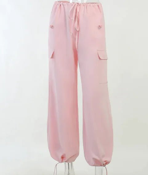 Light Pink Jogger Pants with Elastic Hem – Soft pastel pink jogger pants with a high waist, drawstring tie, and elasticated cuffs for a casual yet stylish appearance.