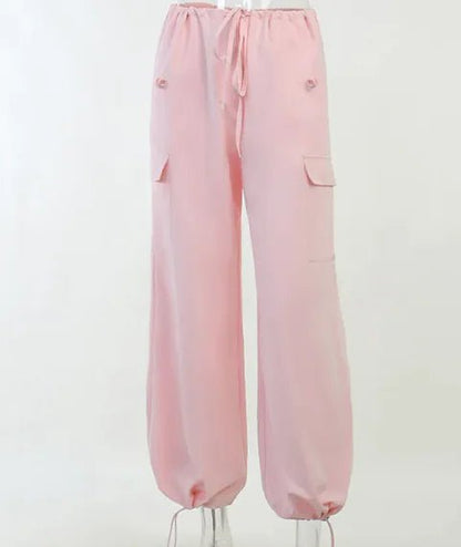 Light Pink Jogger Pants with Elastic Hem – Soft pastel pink jogger pants with a high waist, drawstring tie, and elasticated cuffs for a casual yet stylish appearance.