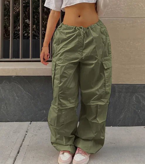 olive green Jogger Pants with Cargo Pockets – High-waisted dark gray cargo jogger pants with drawstring waist and relaxed wide-leg fit.
