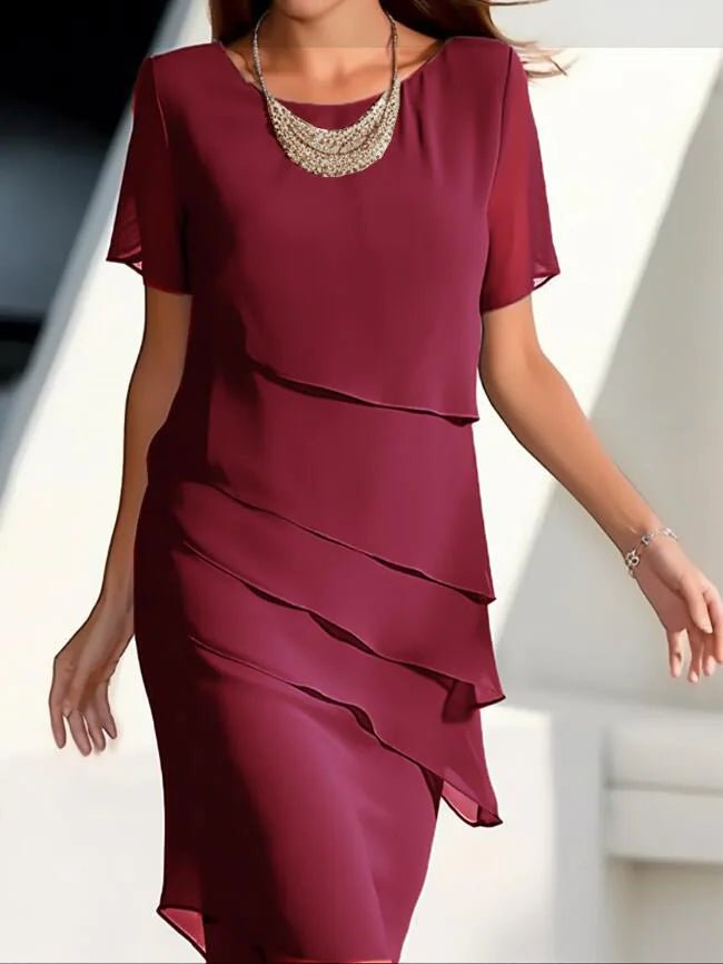 Elegant women's chiffon patchwork dress in bold red, designed with soft chiffon tiers and short sleeves, combining style and confidence.
