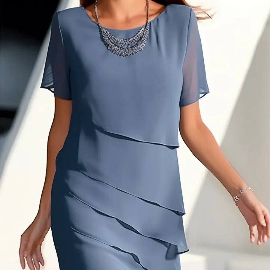 Elegant women's chiffon patchwork dress in vibrant blue, with cascading layers and a soft silhouette, perfect for formal occasions.