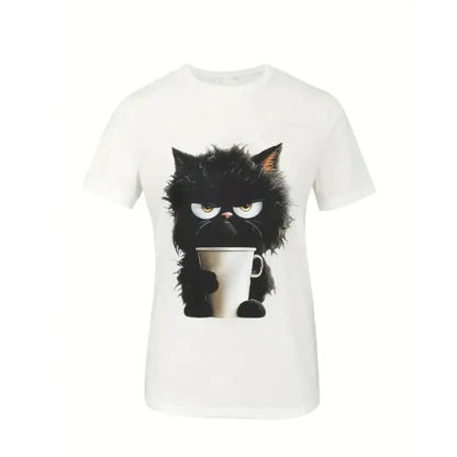 Flat-lay of a white t-shirt with a print of a grumpy black cat holding a coffee cup.