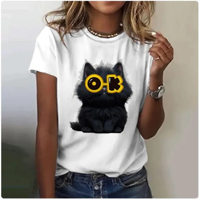 Woman wearing a white t-shirt featuring a grumpy black cartoon cat .