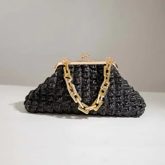 Black pleated handbag with gold chain strap and zip closure.
