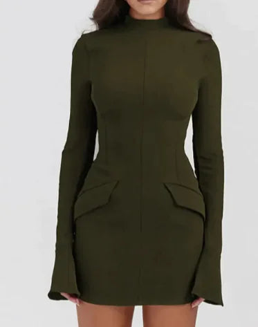 Woman wearing an olive green slim-fit long-sleeve mini dress with a high neckline and flared cuffs.