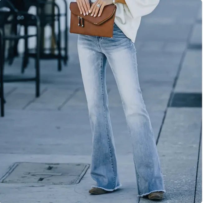 "High-waisted light blue flare jeans with a tailored fit and soft denim finish"