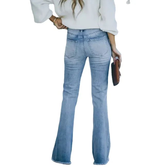 "Back view of high-waisted light blue flare jeans with classic pocket design"