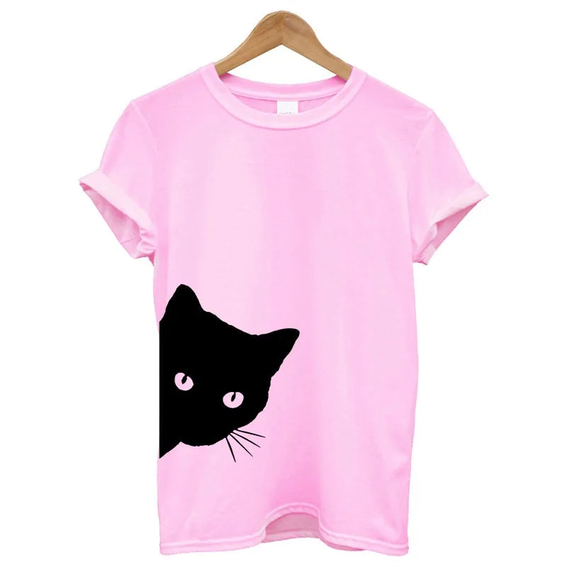 Pink Cat Tee – Soft pink women’s tee adorned with a black cat graphic with matching pink eyes near the hem.