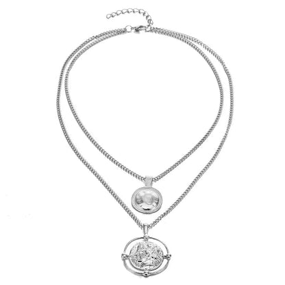 Silver version of the double-chain necklace with coin pendants, displayed against a plain white backdrop.