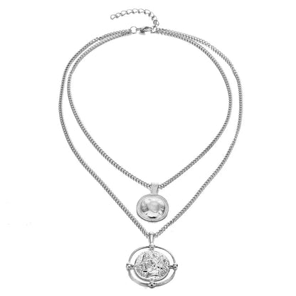 Silver version of the double-chain necklace with coin pendants, displayed against a plain white backdrop.