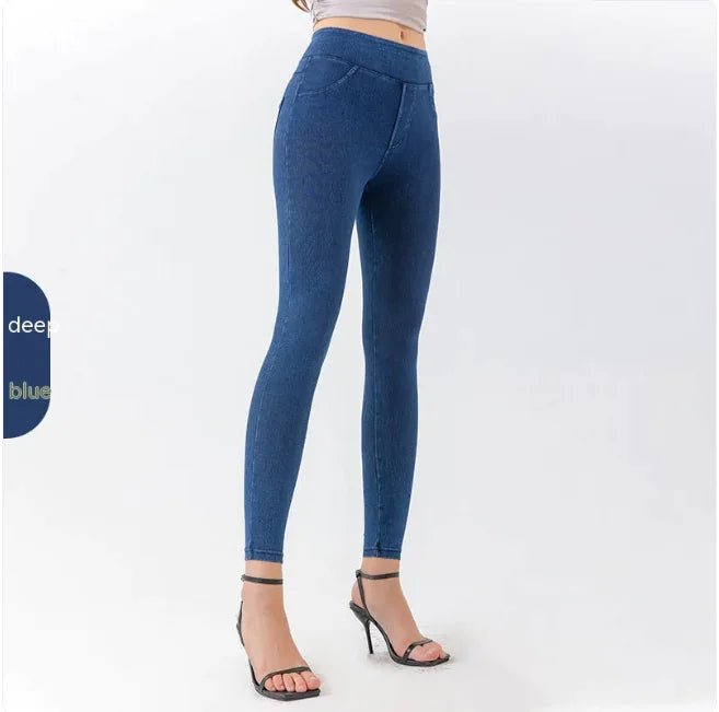 Side view of a woman in high-waist blue denim leggings, highlighting the slim fit and stretchy material.