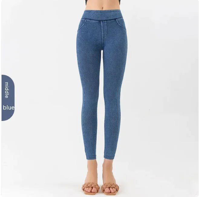 Front view of a woman wearing blue high-waist denim leggings, emphasizing the form-fitting design.