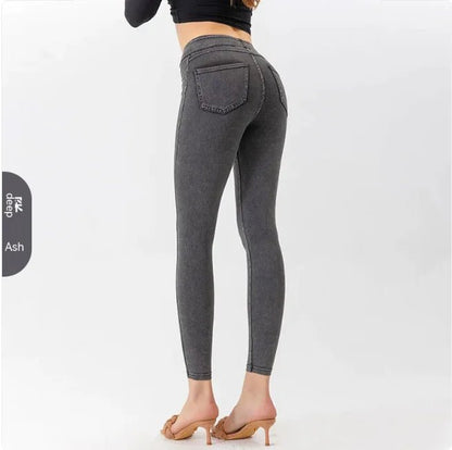 Back view of gray high-waist denim leggings with visible pocket detailing and snug silhouette.